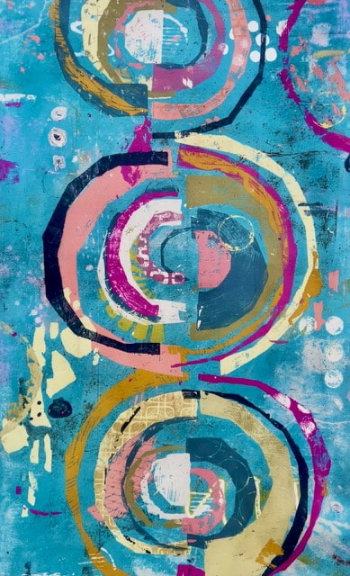 A piece of art from the NKollectiv galleries featuring an abstract design on colored circles on a blue background.